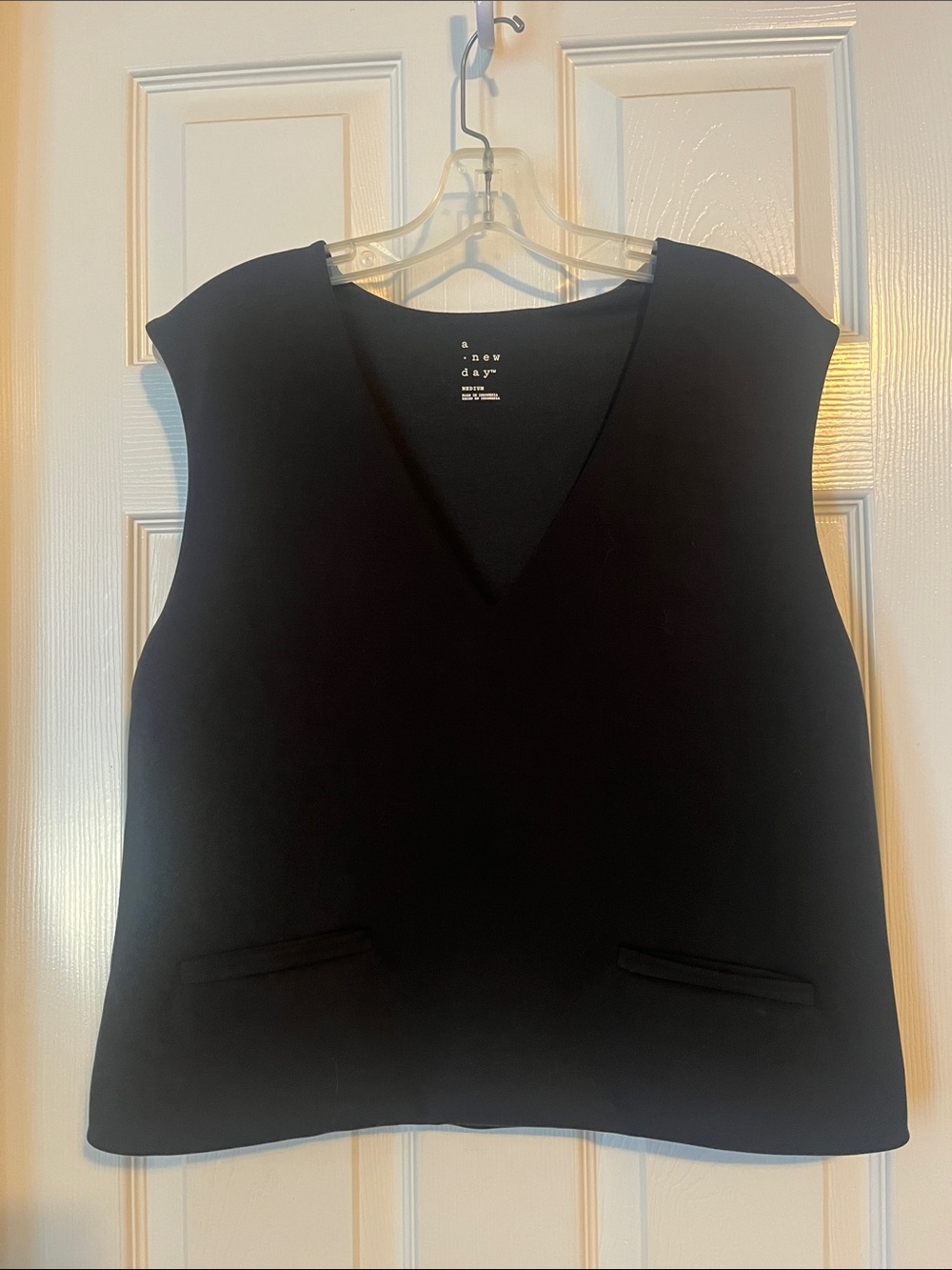 Professional & Sexy Black V-Neck Sleeveless Top with Welt Pockets